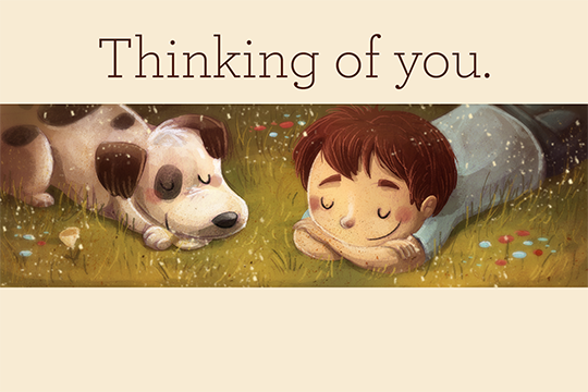 beige "thinking of you" card with illustration of young boy and dog laying in the grass 